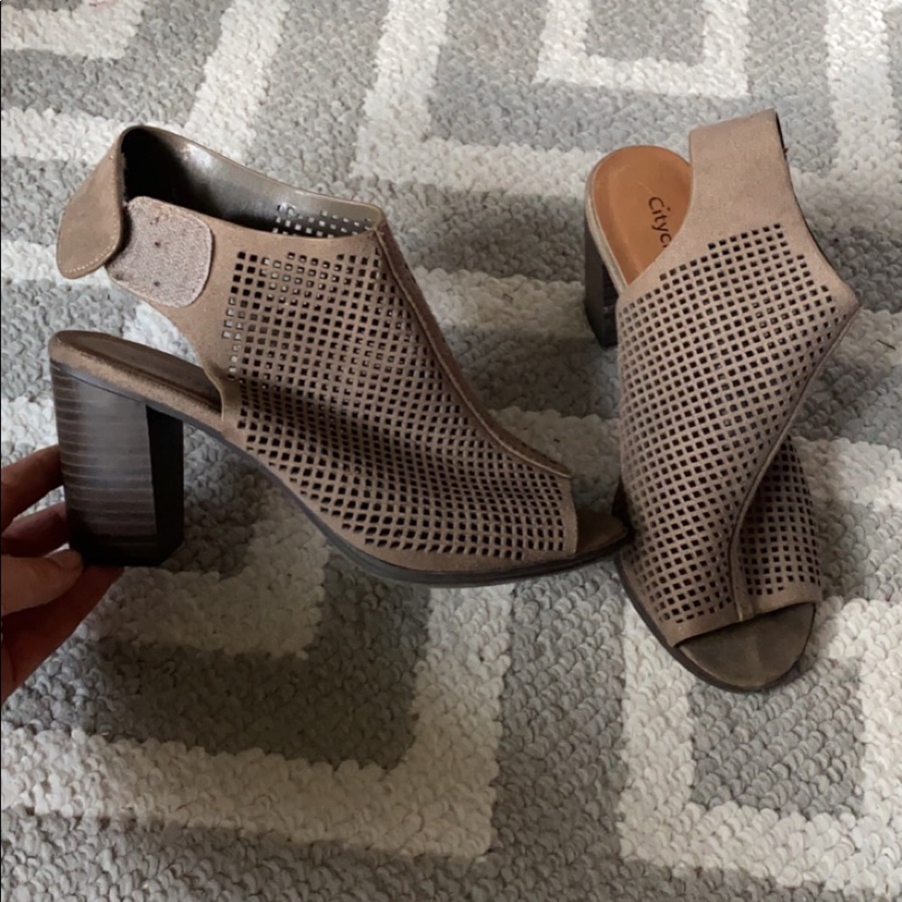 Lightly worn, open toed booties.